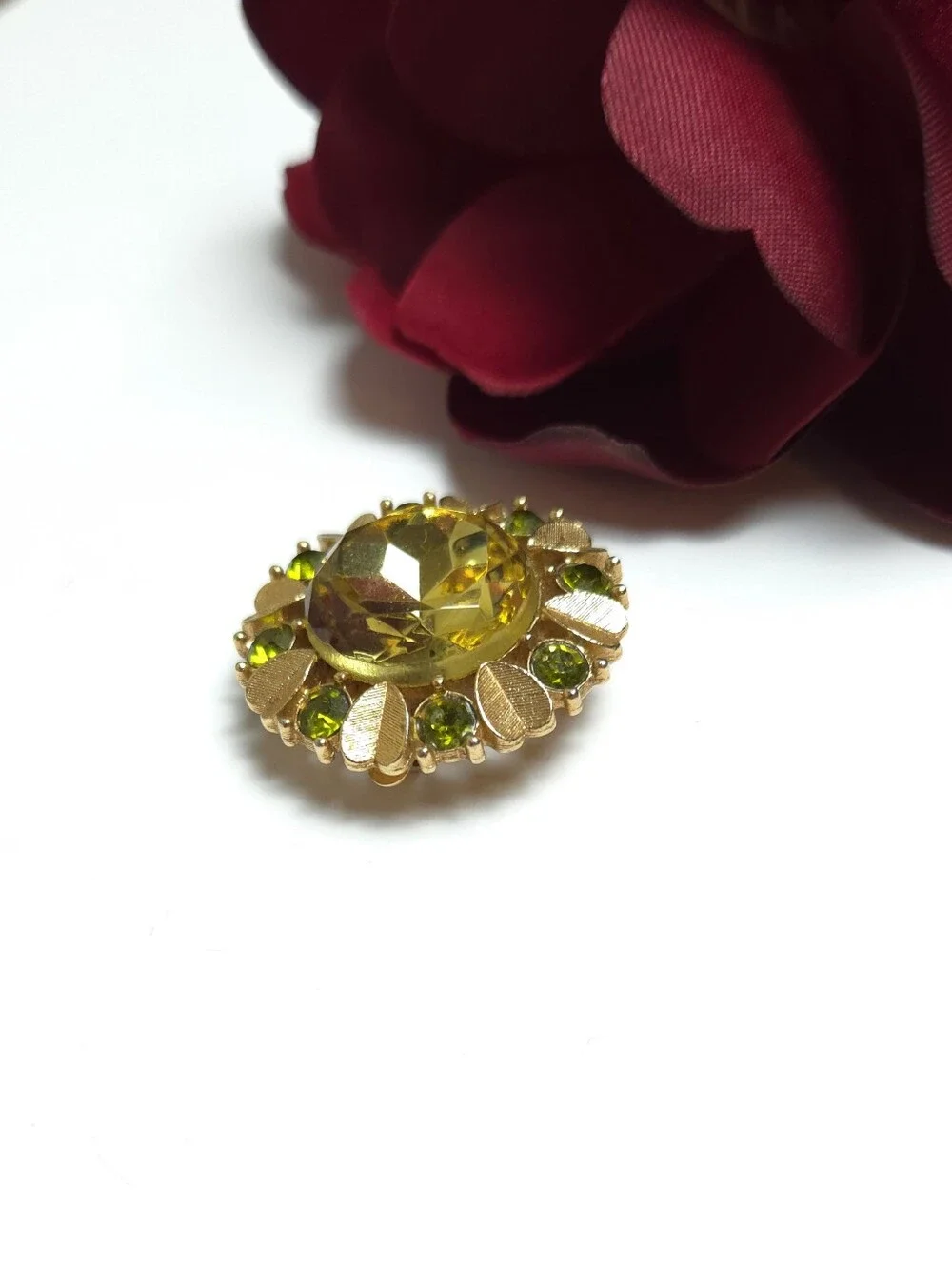Vintage Avon 'Sun Brilliance' Green Crystal Gold Tone Brooch Pendant 1970s Avon